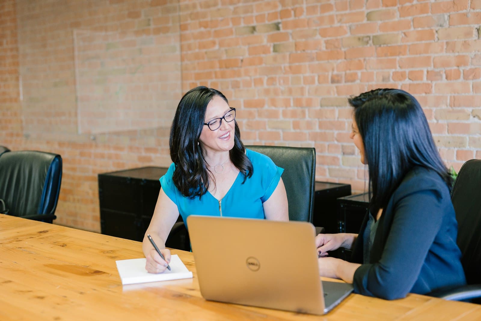 Professional reviewing financial documents and working at a clean desk in natural light